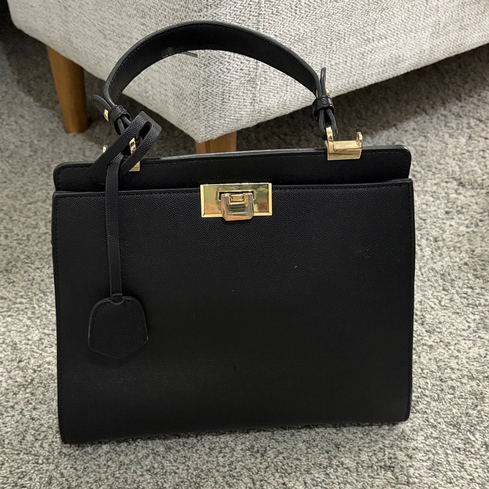 Chic Black Satchel with Gold Accents